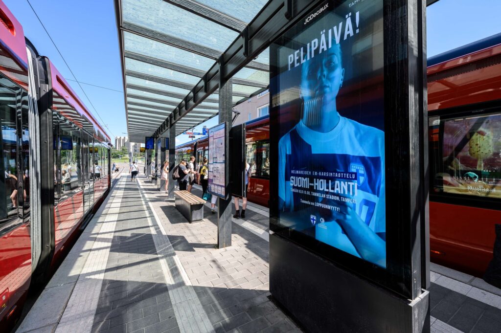 Digital advertising screen on a railway stop.