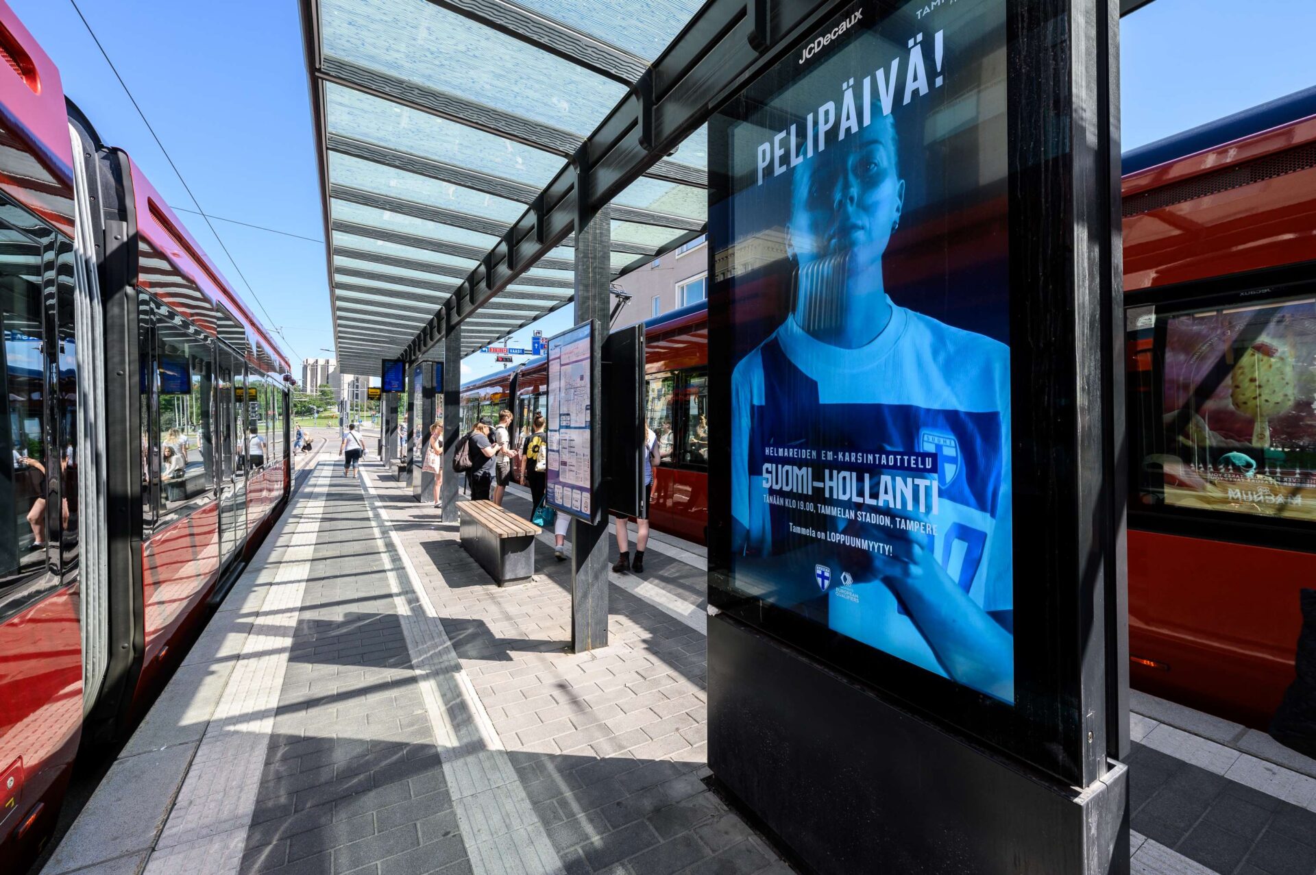 Digital advertising screen on a railway stop.